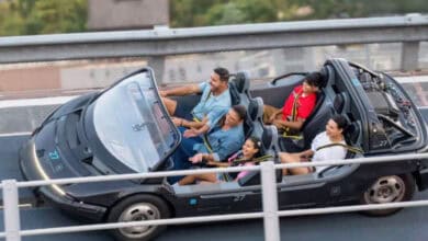 A family riding Test Track at EPCOT.