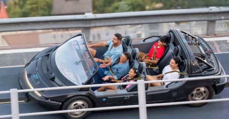 A family riding Test Track at EPCOT.