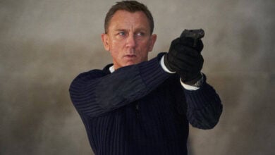 James Bond as 007 aiming his handgun.