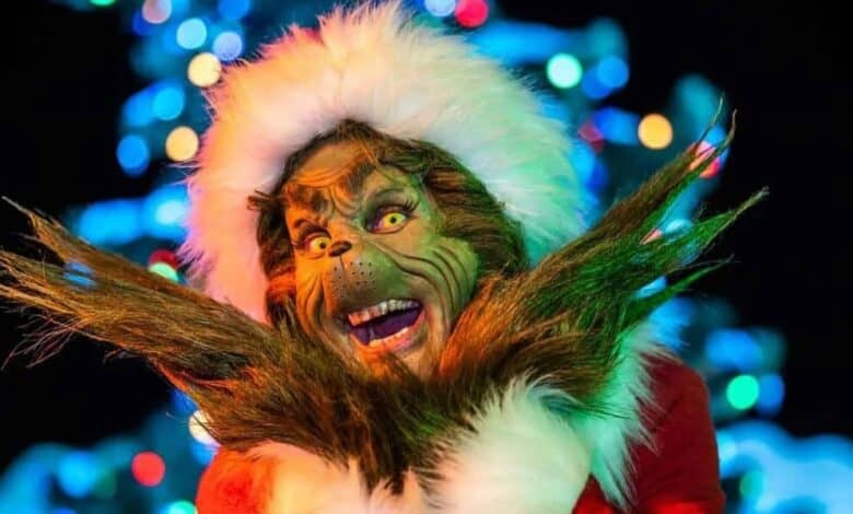 The Grinch wearing a Santa hat at Universal Studios.