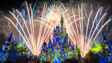 Fireworks illuminate the night sky behind Cinderella Castle at Magic Kingdom.