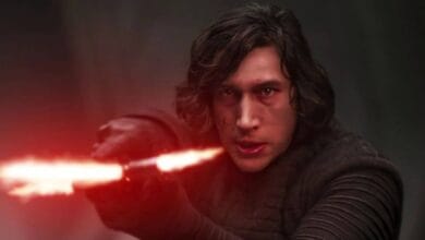 Kylo Ren wielding his red crossguard lightsaber at Star Wars: Galaxy’s Edge.