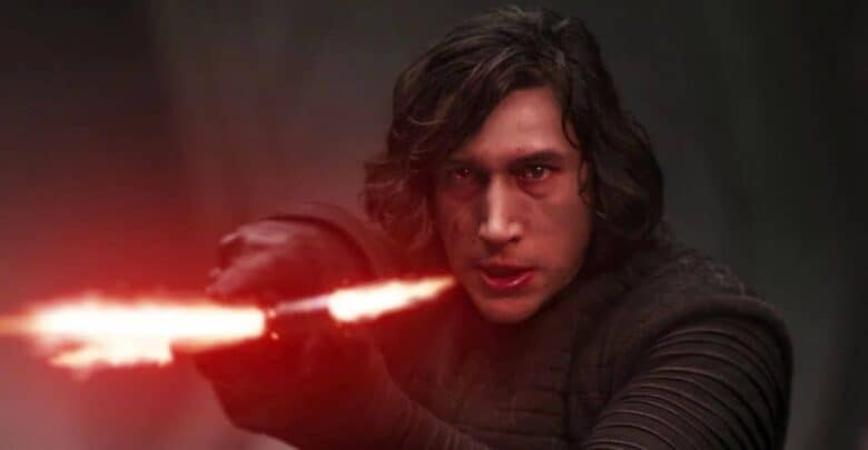 Kylo Ren wielding his red crossguard lightsaber at Star Wars: Galaxy’s Edge.