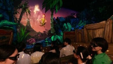 Peter Pan and Tinker Bell on the Peter Pan’s Flight attraction at Disney.
