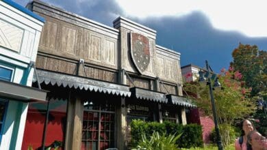 The Six Ravens shop exterior at Fantasy Faire in Disneyland, reminiscent of a pin trading event at Disney Springs.