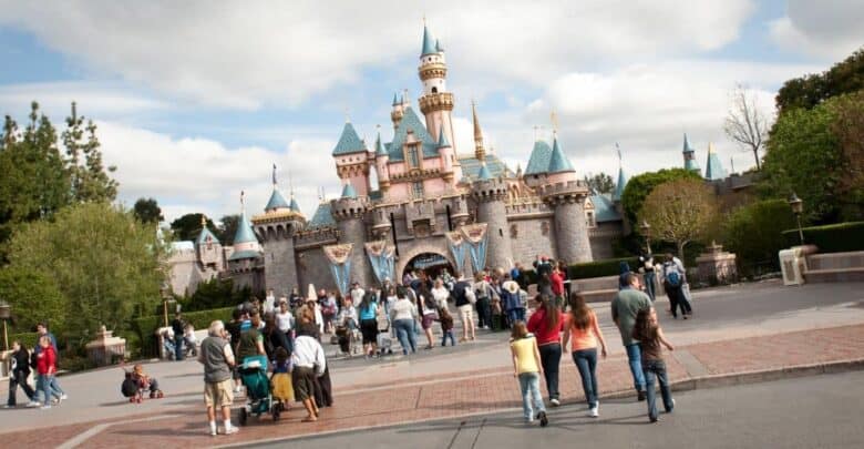 Guests walk toward the entrance of Sleeping Beauty Castle at Disneyland.