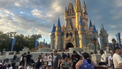Cinderella Castle at Magic Kingdom during a busy holiday weekend.