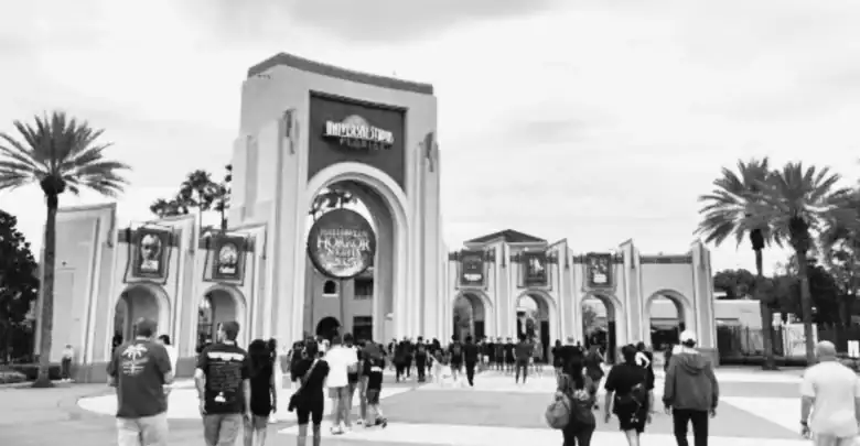 Halloween Horror Nights sign at the Universal Orlando entrance arch.